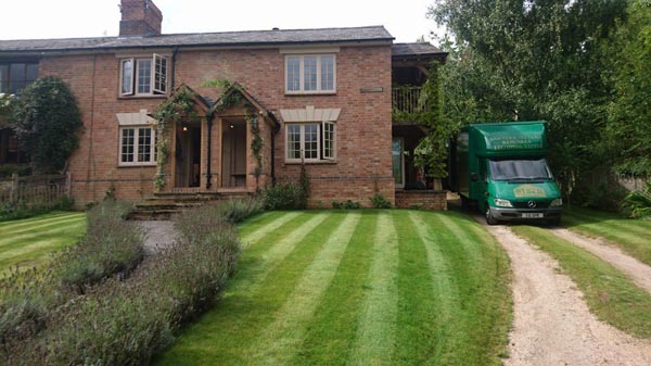 house, garden with van to the side