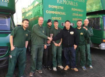 the team of sawyerr peters with a happy customer